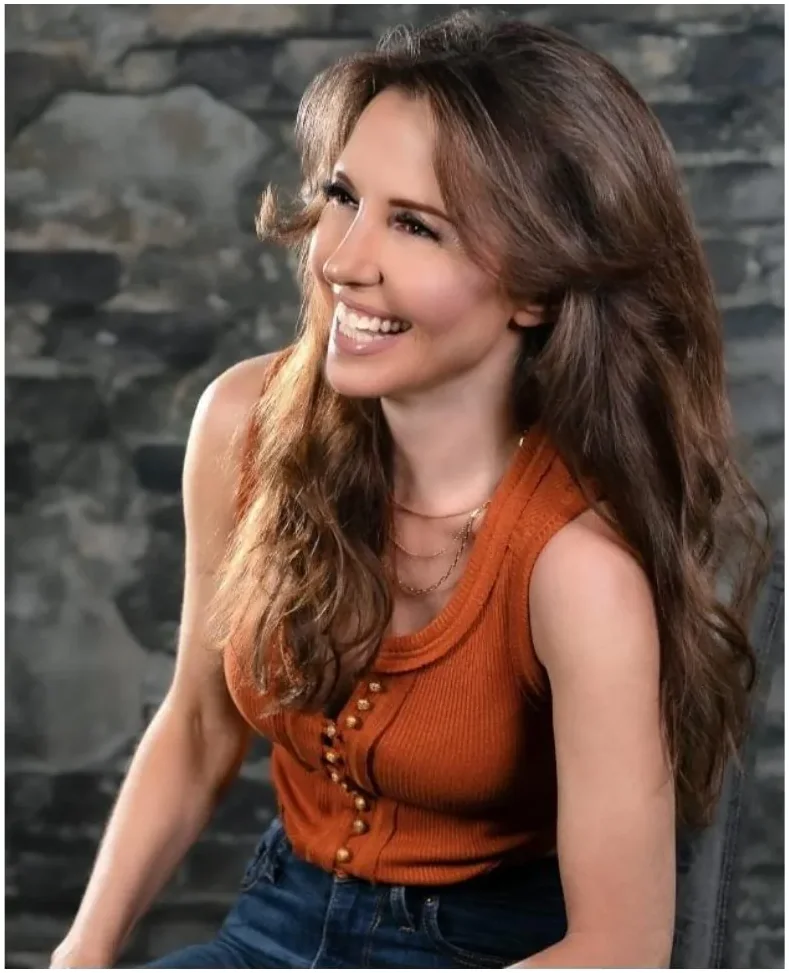 Amanda Kasmira &ldquo;Kazzy&rdquo; Cryer — rust-colored editorial portrait